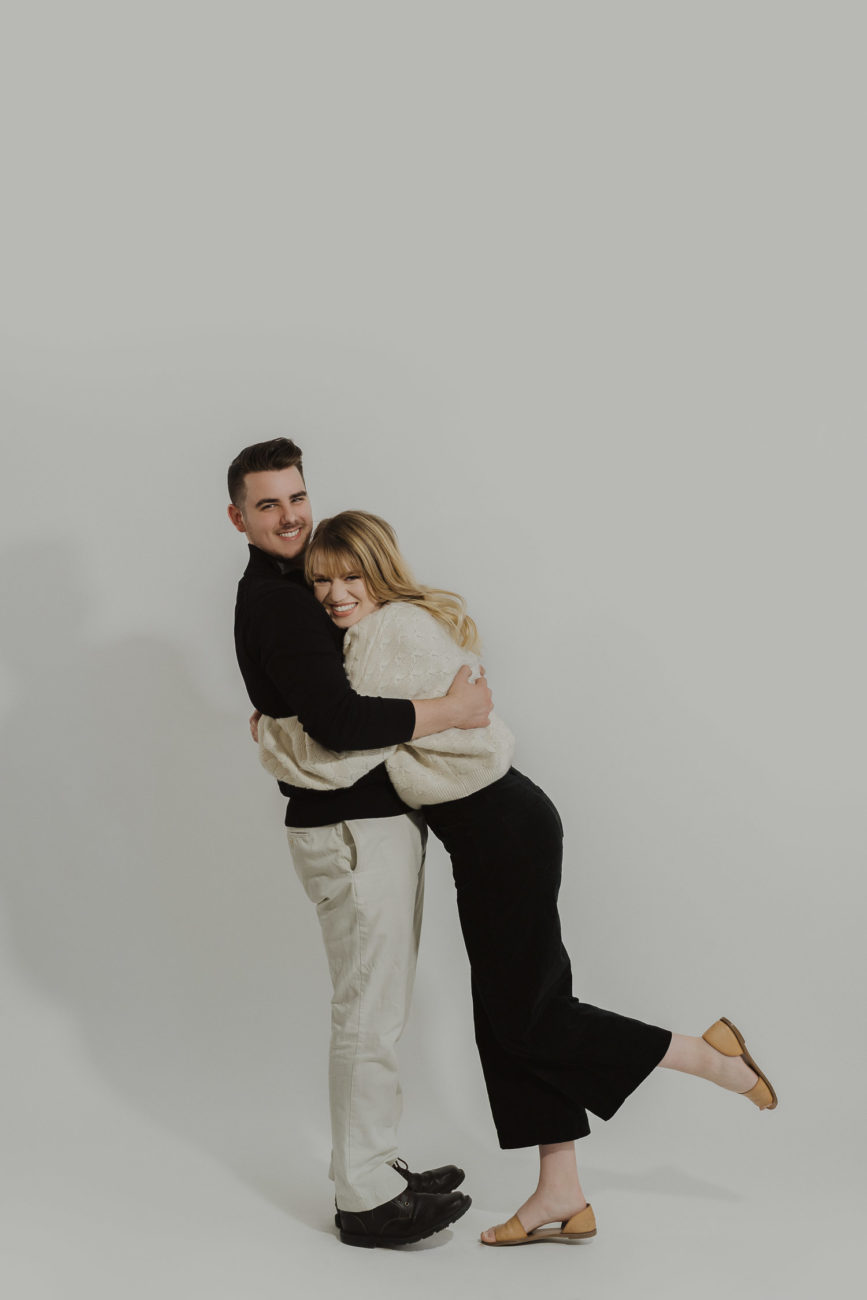 couple-photos-in-studio-with-white-background-black-and-white-outfit-inspo-tulsa-photographer