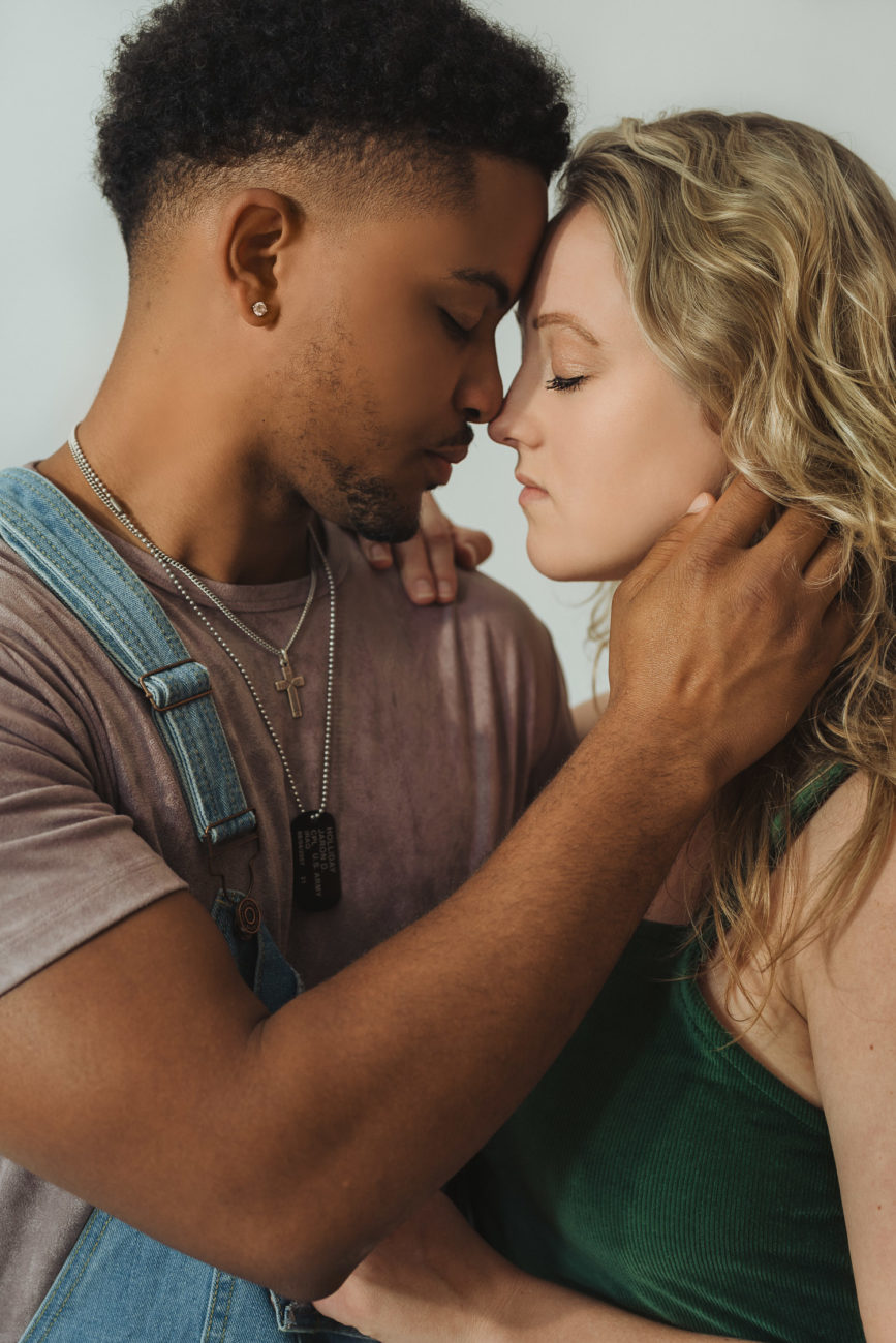 interracial-couple-in-studio-white-background-embracing-face-intimate-photo-tulsa-photographer